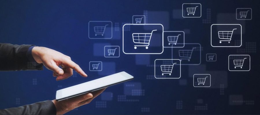Hand touching a tablet with shopping cart icons representing an online rental marketplace